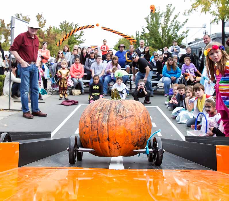 John Byrne/Tribune A pumpkin heads down the elevated runway toward its owner at the finish line during the annual Pumpkin Derby, part of Sunday’s PumpkinPalooza activities at Victorian Square. Organizers said the event, which benefits the Northern Nevada Center for Independent Living, attracted about 8,500 people to downtown Sparks.