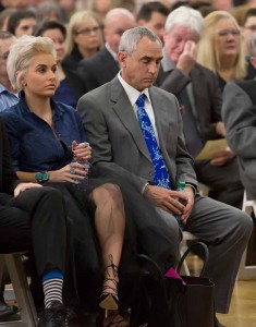 John Byrne/Tribune Erin Smith, left, and her father, Greg, listen as state Sen. Debbie Smith is remembered at a memorial service in the Sparks High School gym.