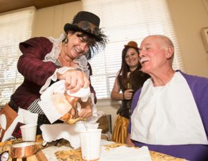John Byrne photos/Tribune -  The Sparks Heritage Museum hosted a “Building Steam” fundraiser on Saturday to raise money for its endowment fund. (Above) Lisa Fisher serves tea during one of the events. 