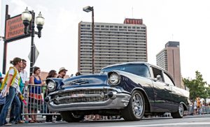 John Byrne/Tribune file photo -  A classic Chevrolet car passes by spectators in Victorian Square during a Hot August Nights Sparks Cruise last year. The 30th annual event kicks off Saturday and runs through Aug. 7.
